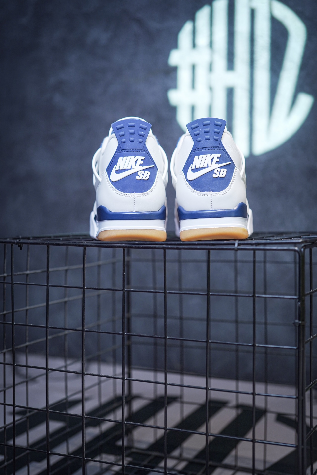 NK SB x Air Jordan 4 'Navy' collaboration in white and blue.