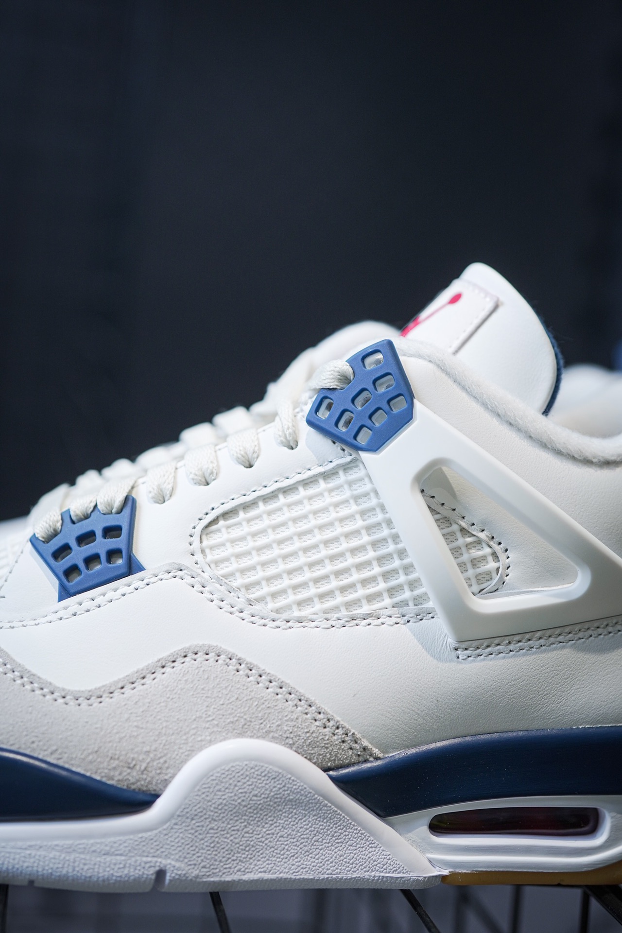 NK SB x Air Jordan 4 'Navy' collaboration in white and blue.