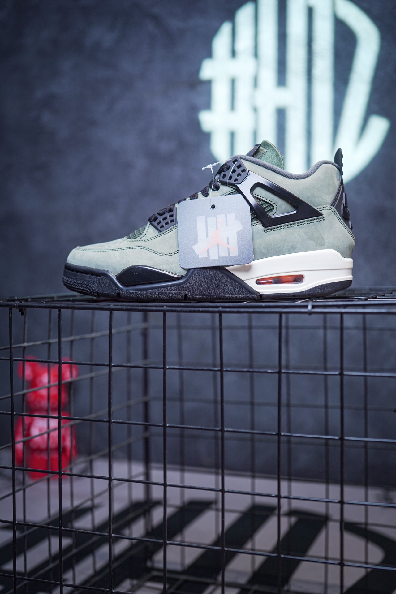 NK SB x Air Jordan 4 collaboration in white and red, military green, gray and brown, and red brick.
