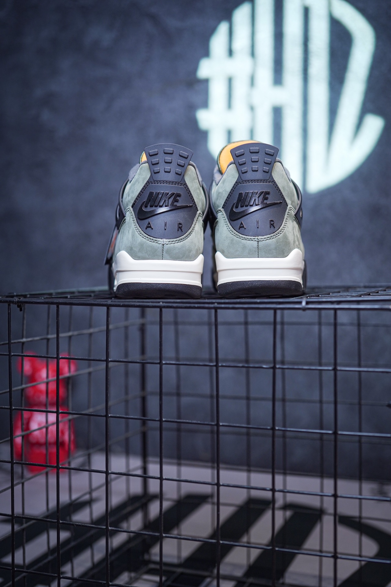 NK SB x Air Jordan 4 collaboration in white and red, military green, gray and brown, and red brick.