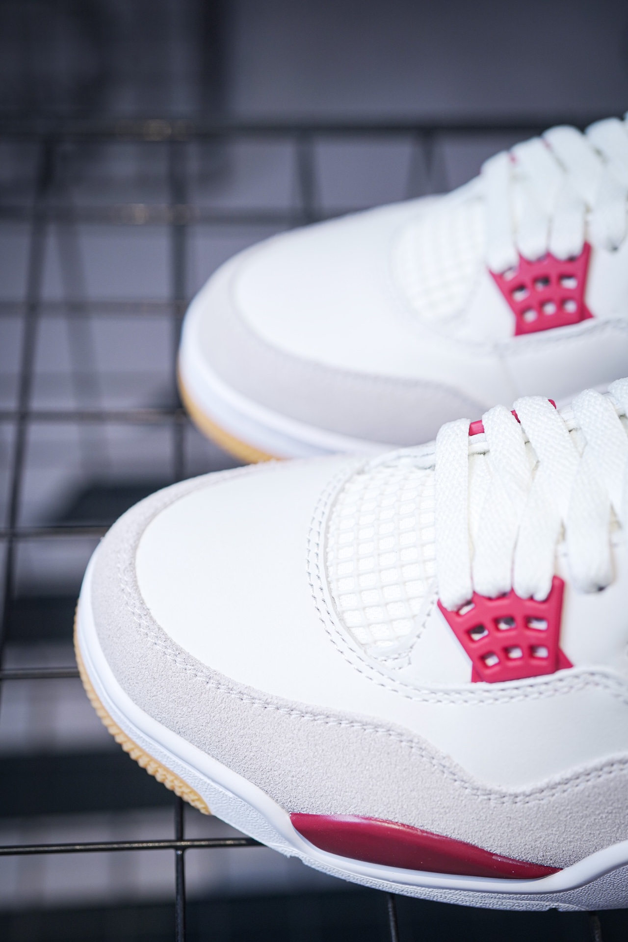NK SB x Air Jordan 4 collaboration in white and red, military green, gray and brown, and red brick.