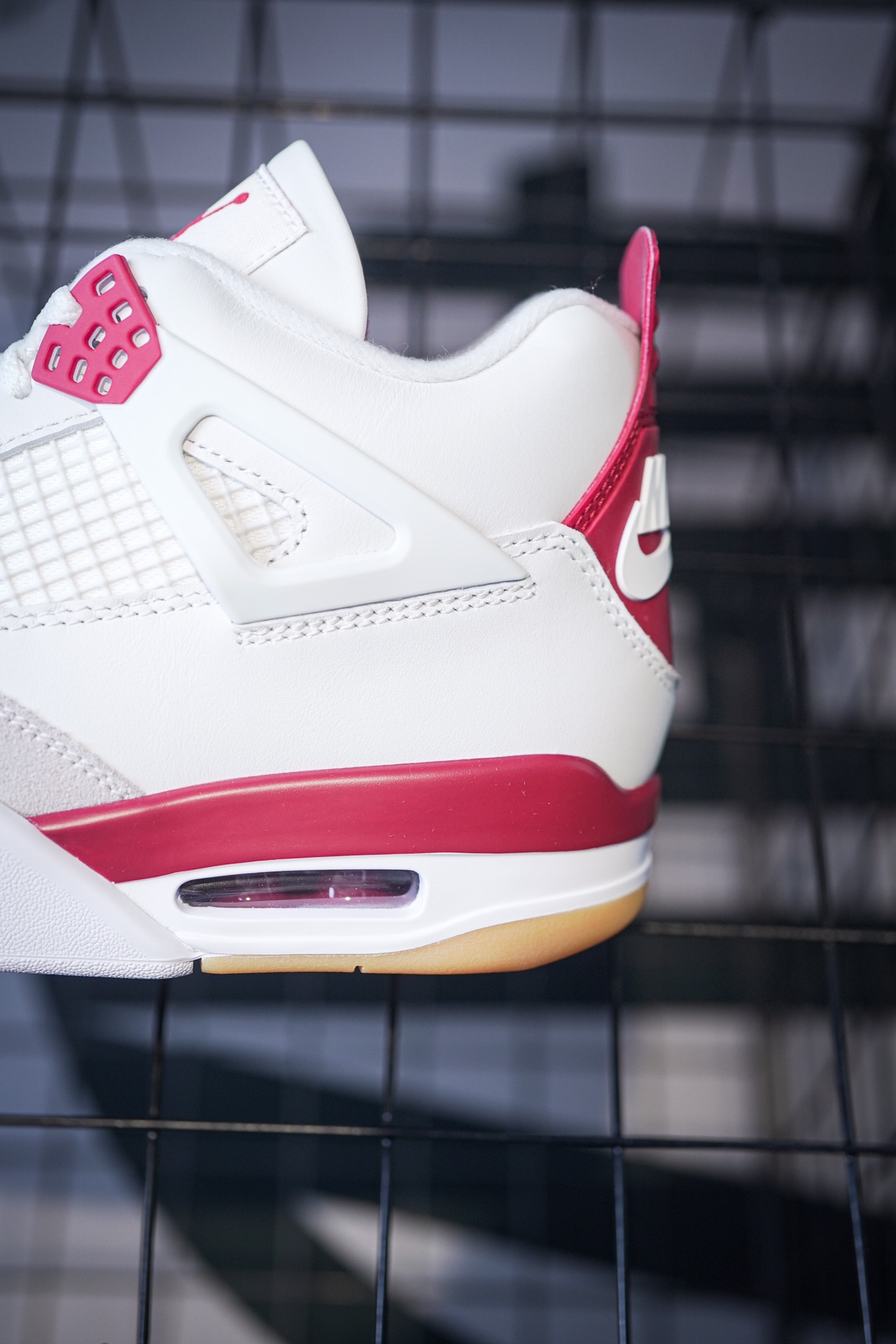 NK SB x Air Jordan 4 collaboration in white and red, military green, gray and brown, and red brick.